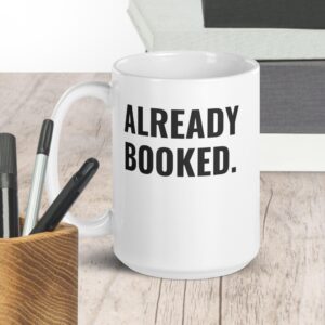 “Already Booked.” White glossy mug